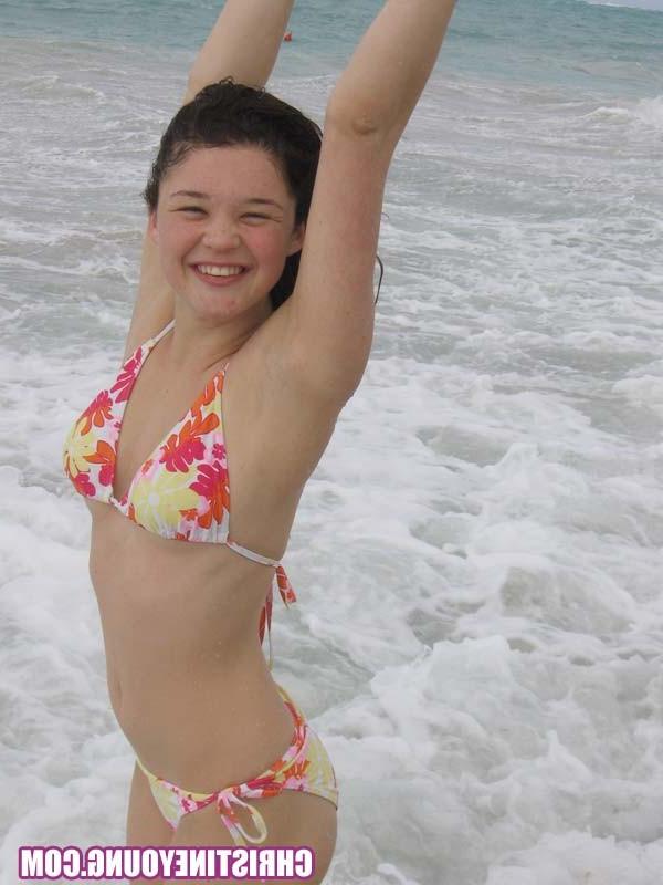 15P Cute young hottie Christine Young teasing on a nice beach