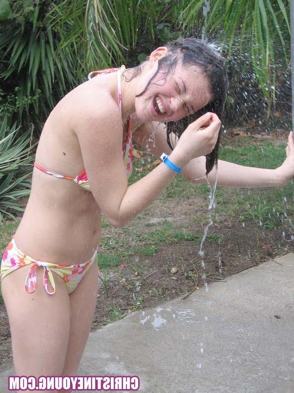 15P Cute young hottie Christine Young teasing on a nice beach