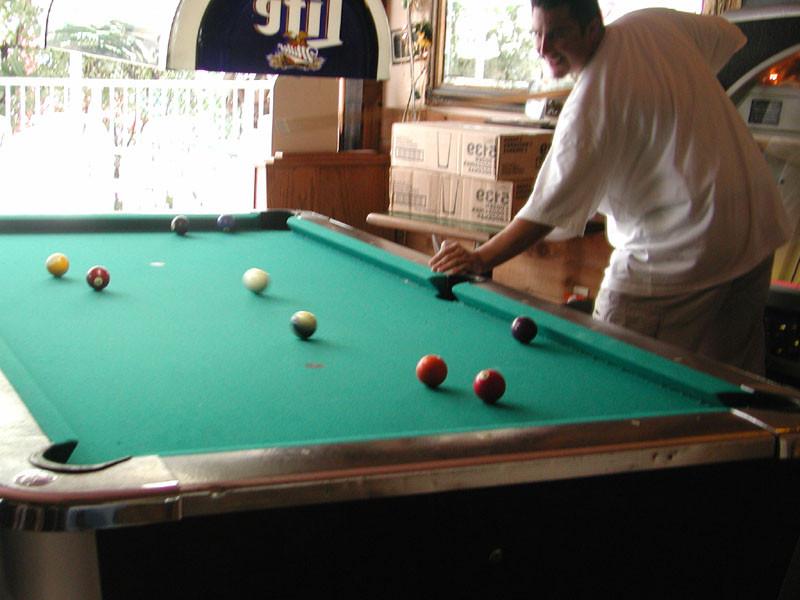 20P Miss Obvious: a smoke while holding a cue stick.
