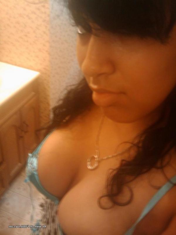 14P Curvy Latina babe shows off her pierced pussy