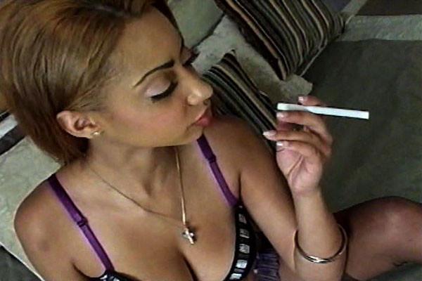 15P A chocolate chick with a strong love of cigarettes lights up while half-undresse