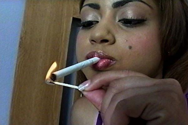 15P A chocolate chick with a strong love of cigarettes lights up while half-undresse
