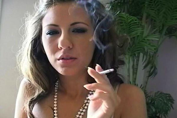 15P A smokin gal bedecked in pearls emits smoke curls into the air around her as she