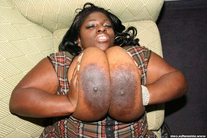 12P Simone Fox lubes up her gigantic juggs