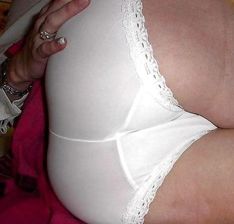 14P Female ass in underwear and pantyhose.