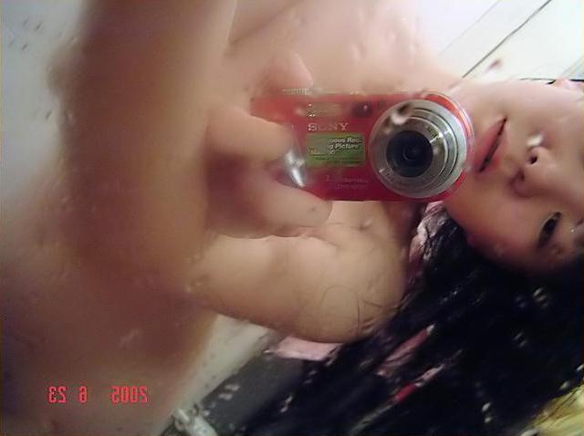 18P Wild cutie strips out of winter clothes and takes selfpics