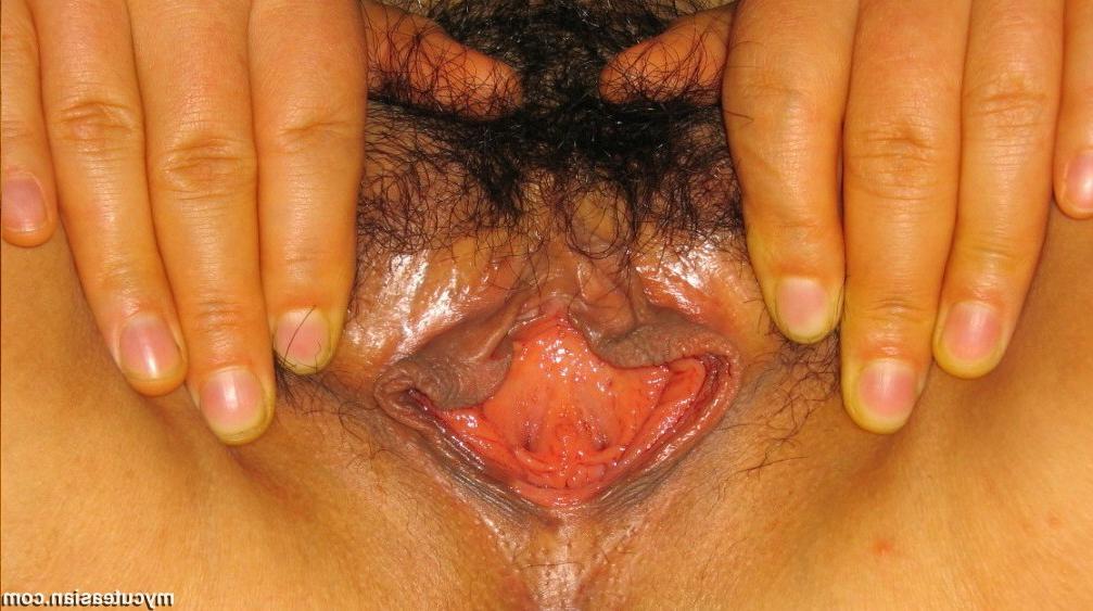 15P Asian shows her natural boobs and wet pussy
