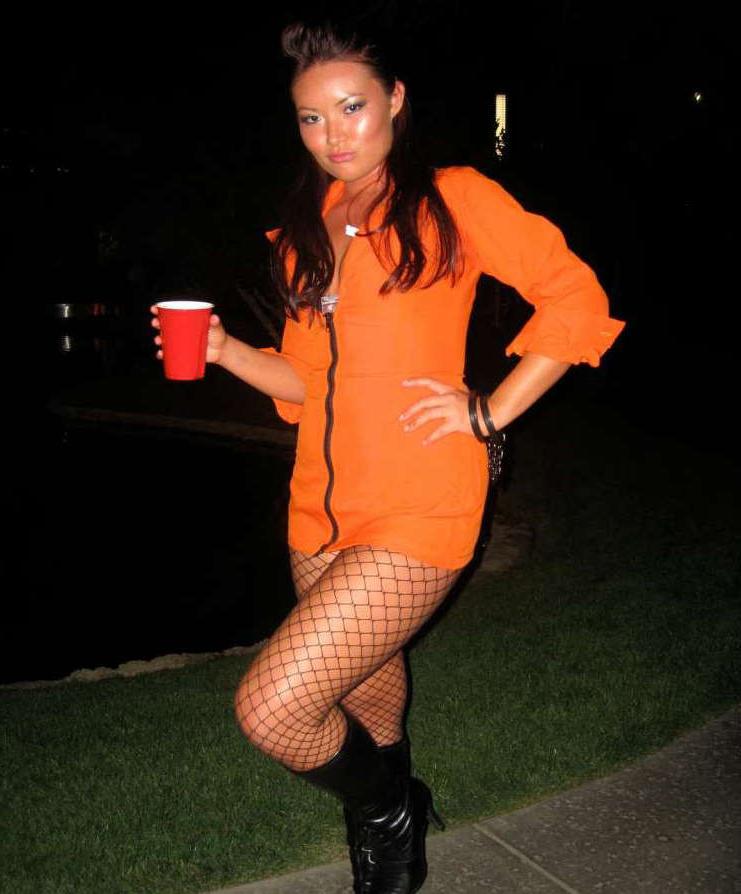 15P Pictures of an Oriental tease posing sexy in a party