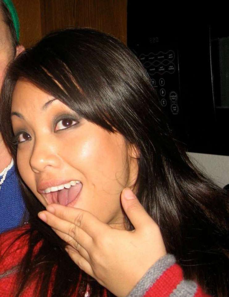 15P Pictures of an Oriental tease posing sexy in a party