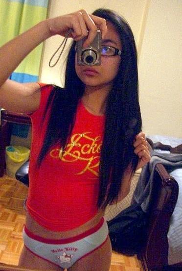 16P Cute Asian teen with glasses taking selfpics