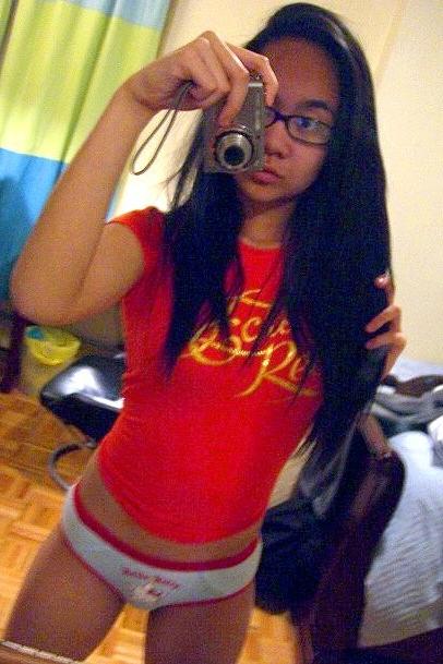 16P Cute Asian teen with glasses taking selfpics