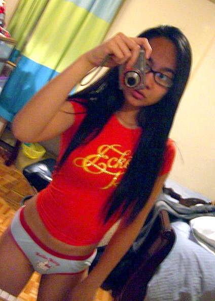 16P Cute Asian teen with glasses taking selfpics