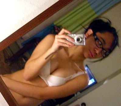 16P Cute Asian teen with glasses taking selfpics