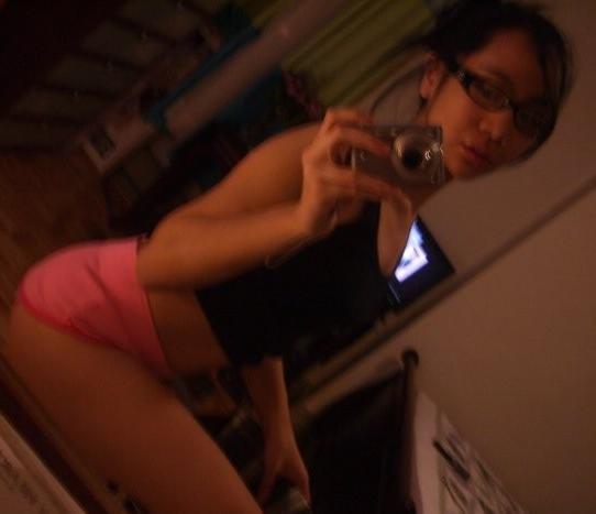 16P Cute Asian teen with glasses taking selfpics