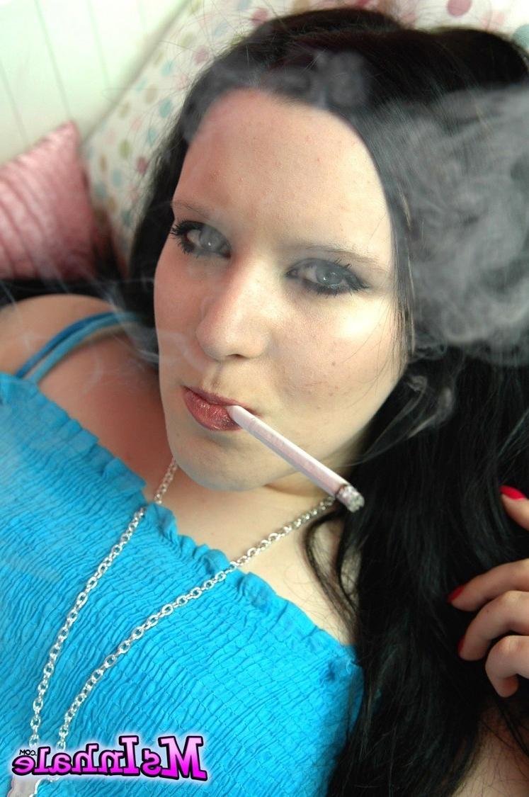 16P Naughty teen smoker rubs her pussy while she smokes a cigarette 