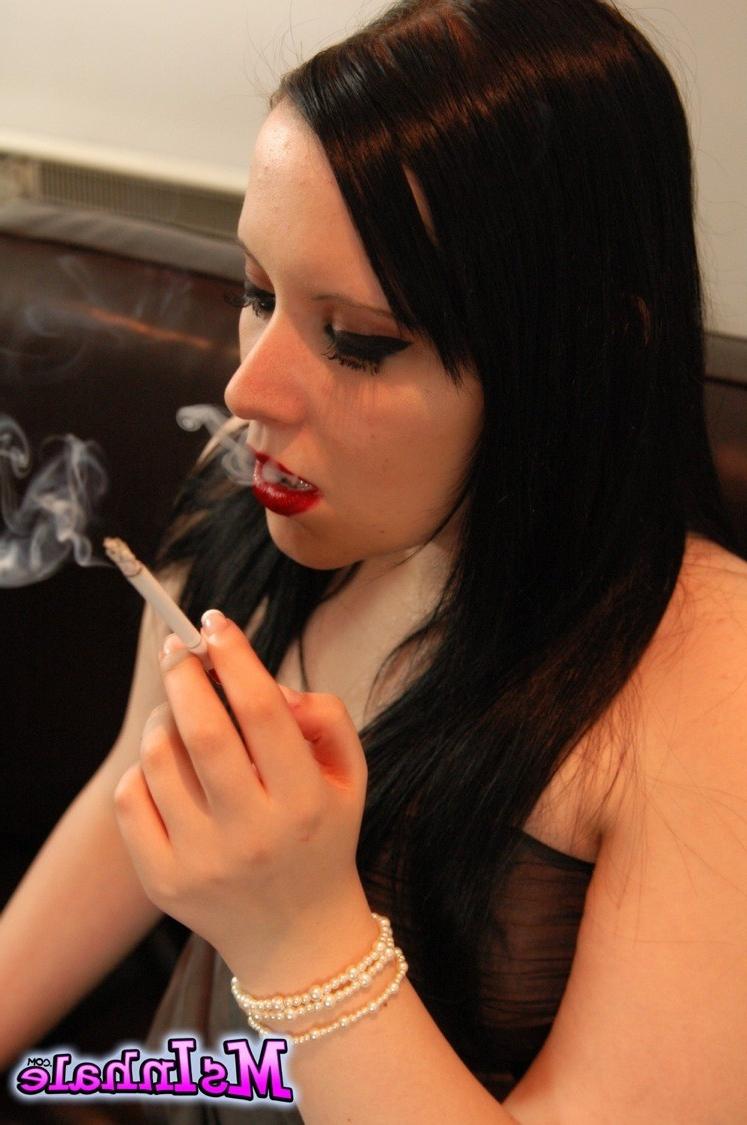 16P Naughty girl pulls her tits our of her dress as she smokes a lon