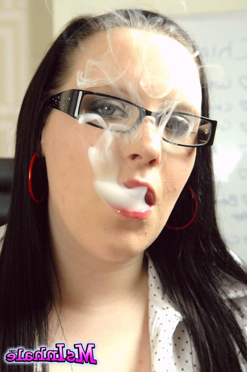 15P Teen secretary in glasses smoking a More 120 cigarette at work