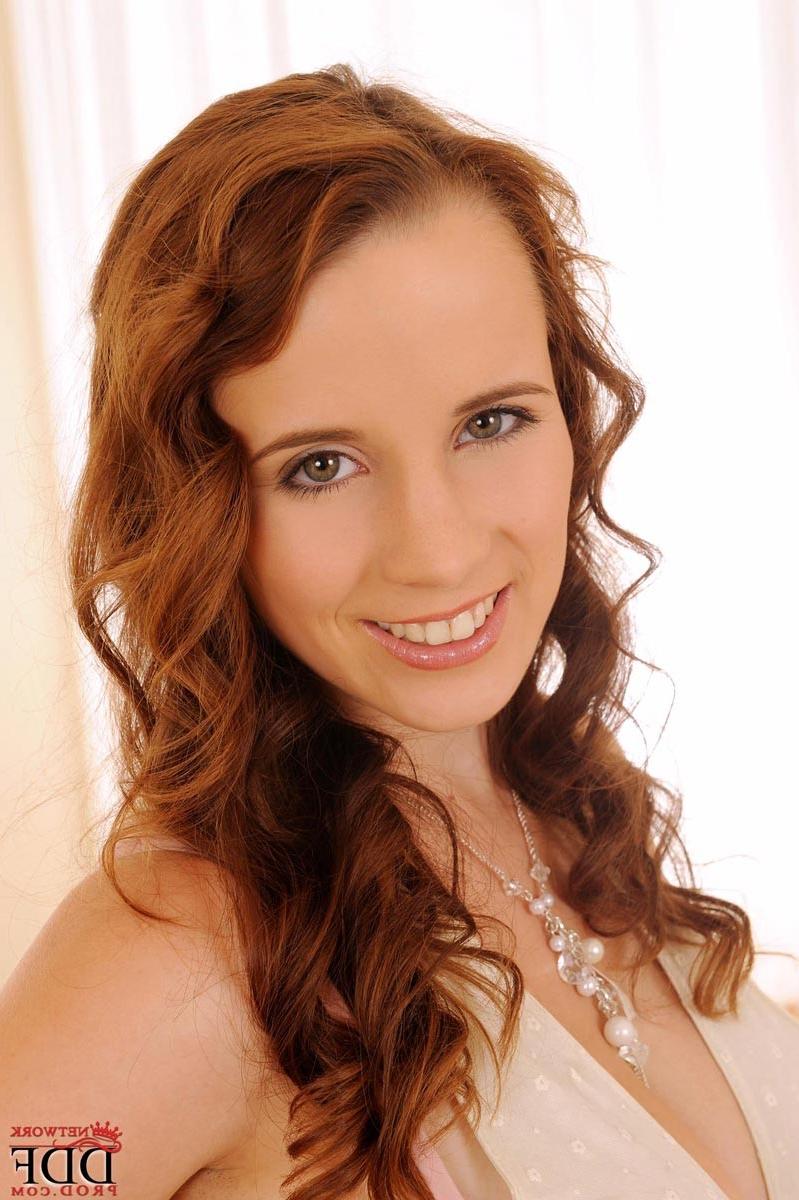 15P Busty redhead strips naked