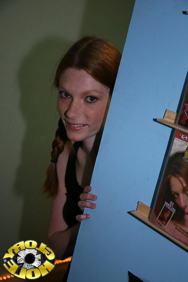 18P Pigtailed redhead teen goes black at a public a dirty gloryhole