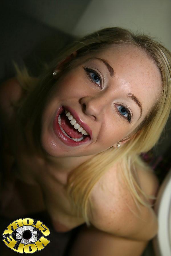 18P beautiful blonde sucking a big black cock at a glory hole