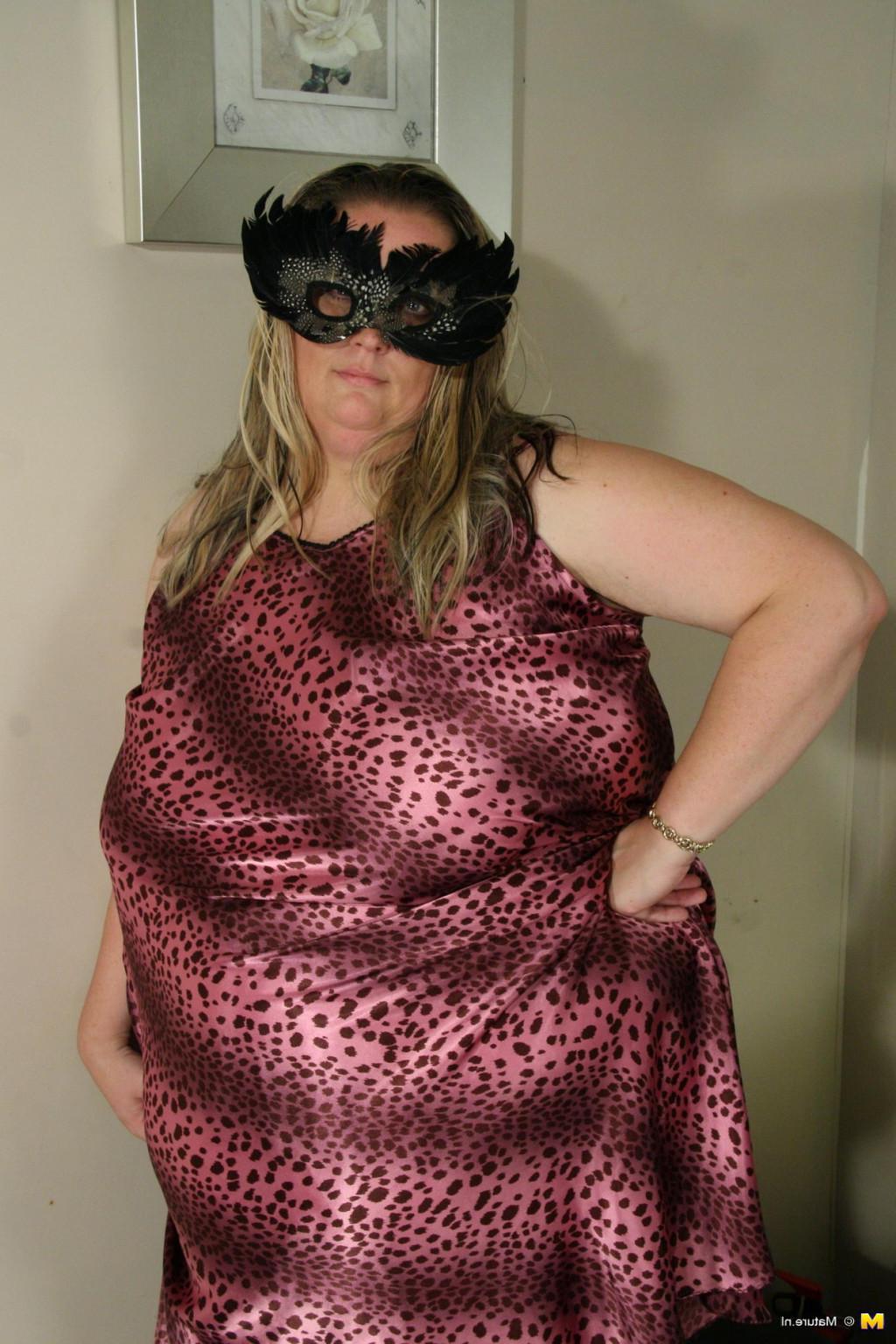 14P Big masked mama getting ready to be kinky