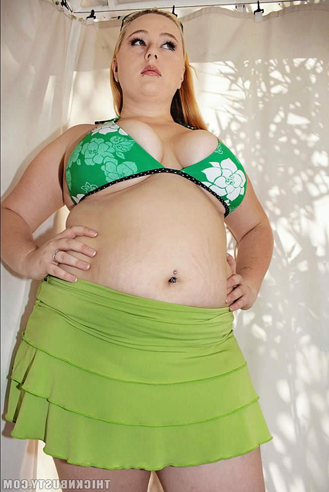 16P Plump blonde in bikini plays with her massive tits