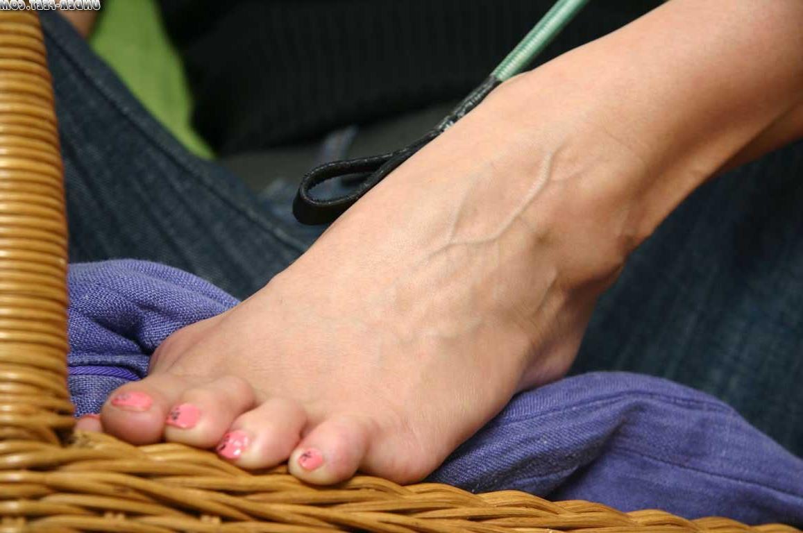 16P Barefoot mistress smokes a cig while playing with her crop whip in front of came