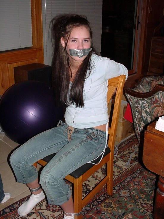 12P Cute school girl tied to a chair