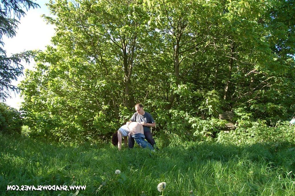 15P Slave girl outdoors stung by stinging nettles