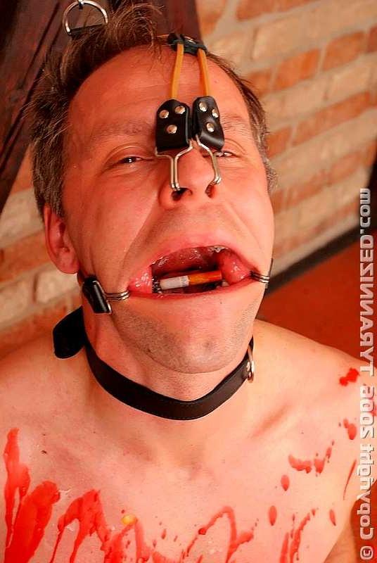 16P Mistress extinguishing her cigarerette on slave