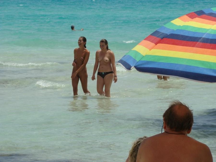 15P Perky breasted nude goddess poses on a nude beach