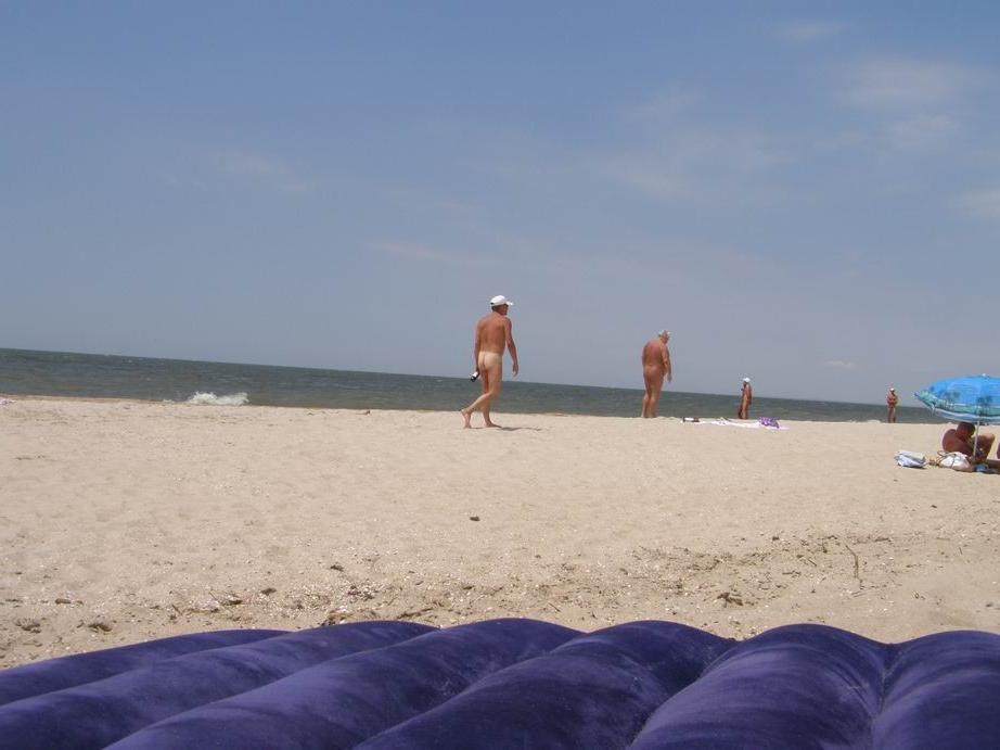 14P These two teen nudists play frisbee in the water