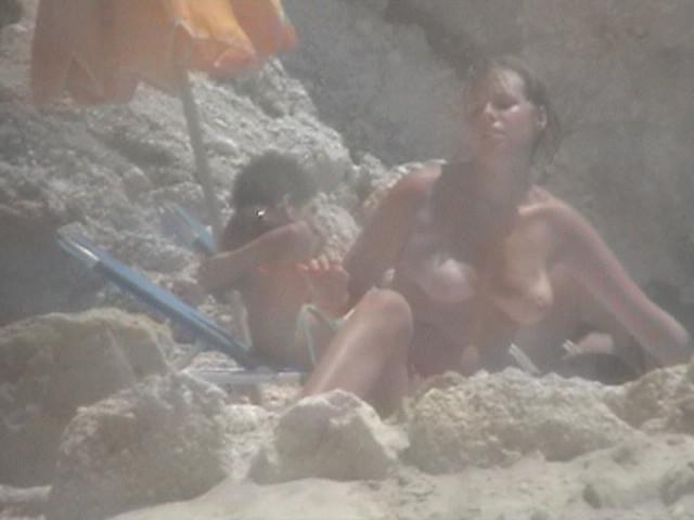 14P These two teen nudists play frisbee in the water