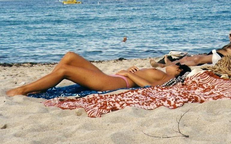 12P Naughty young nudists play with each other in sand