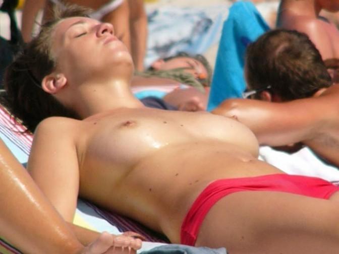 12P Naughty young nudists play with each other in sand
