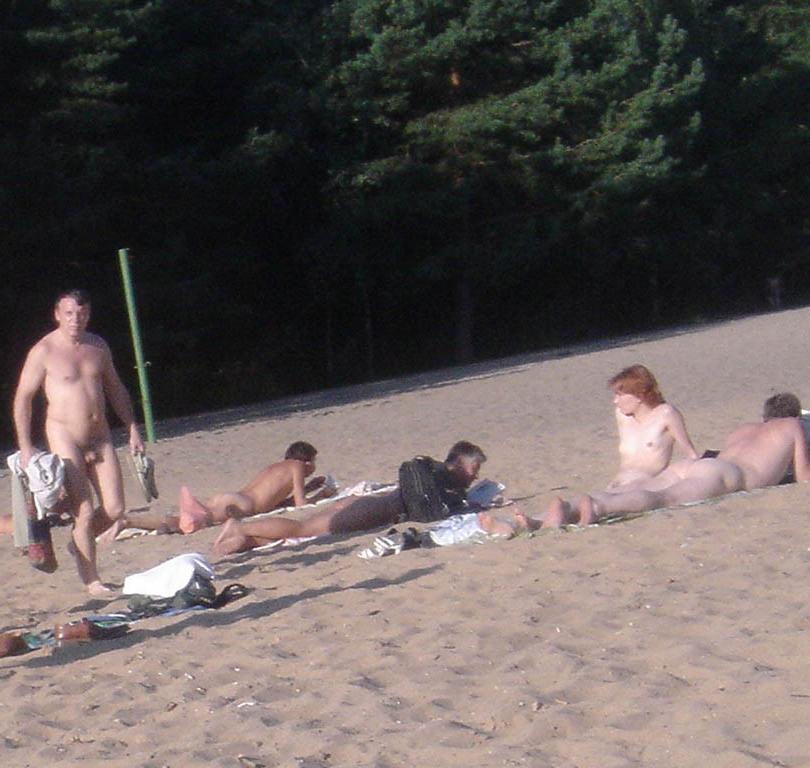 15P Perky breasted nude goddess poses on a nude beach