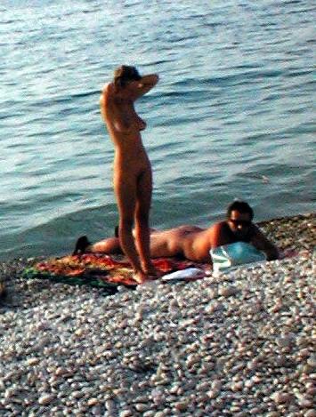 15P Perky breasted nude goddess poses on a nude beach