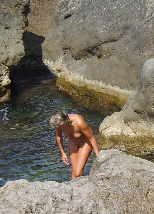 15P Perky breasted nude goddess poses on a nude beach