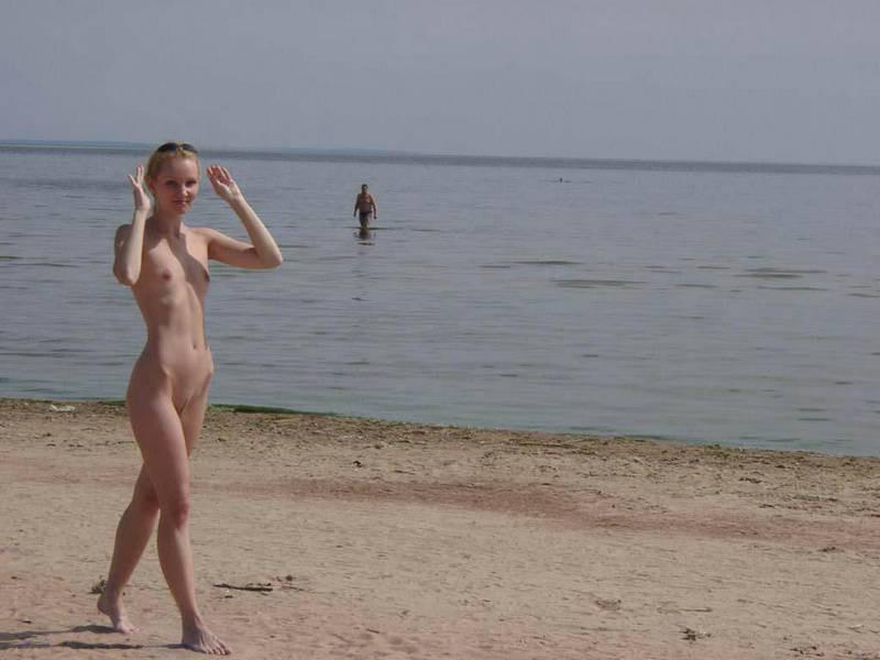 15P Perky breasted nude goddess poses on a nude beach