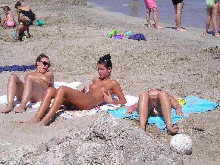 15P These two teen nudists play frisbee in the water