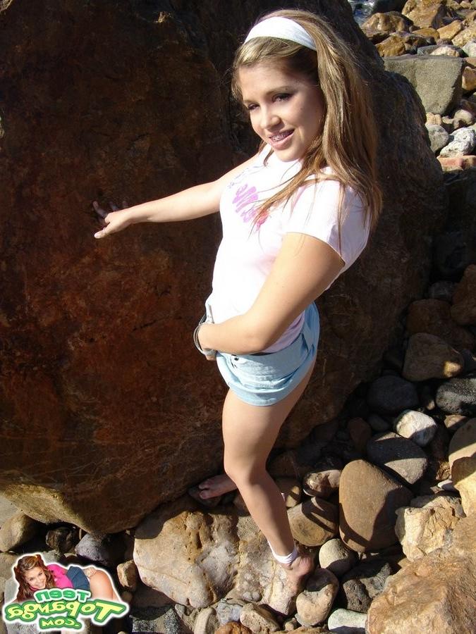 15P Cute Topanga posing outdoors on the rocks topless