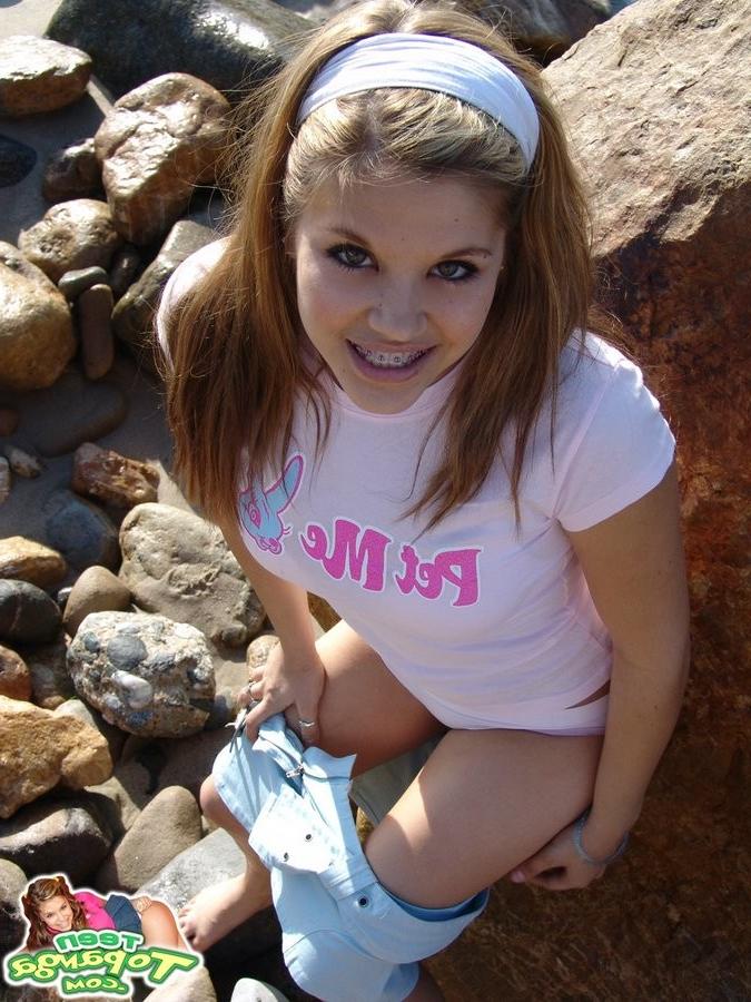 15P Cute Topanga posing outdoors on the rocks topless
