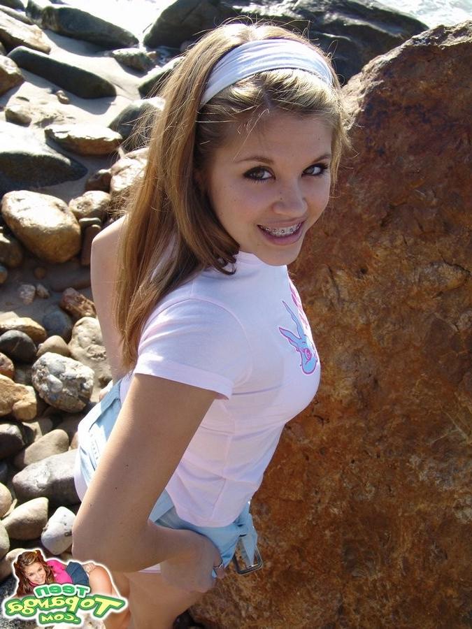 15P Cute Topanga posing outdoors on the rocks topless