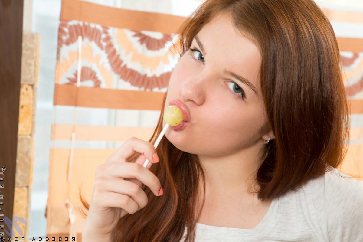 15P Horny amateur teases her creamy twat with lollipop