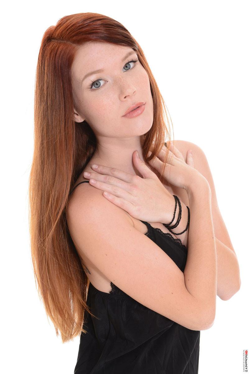 16P Redhead cutie stripping from her black dress