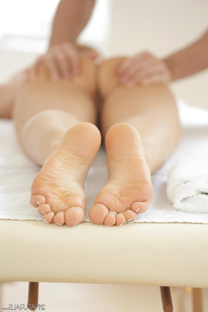 15P Sabina Moore rubs the massage therapists cock with her sexy feet