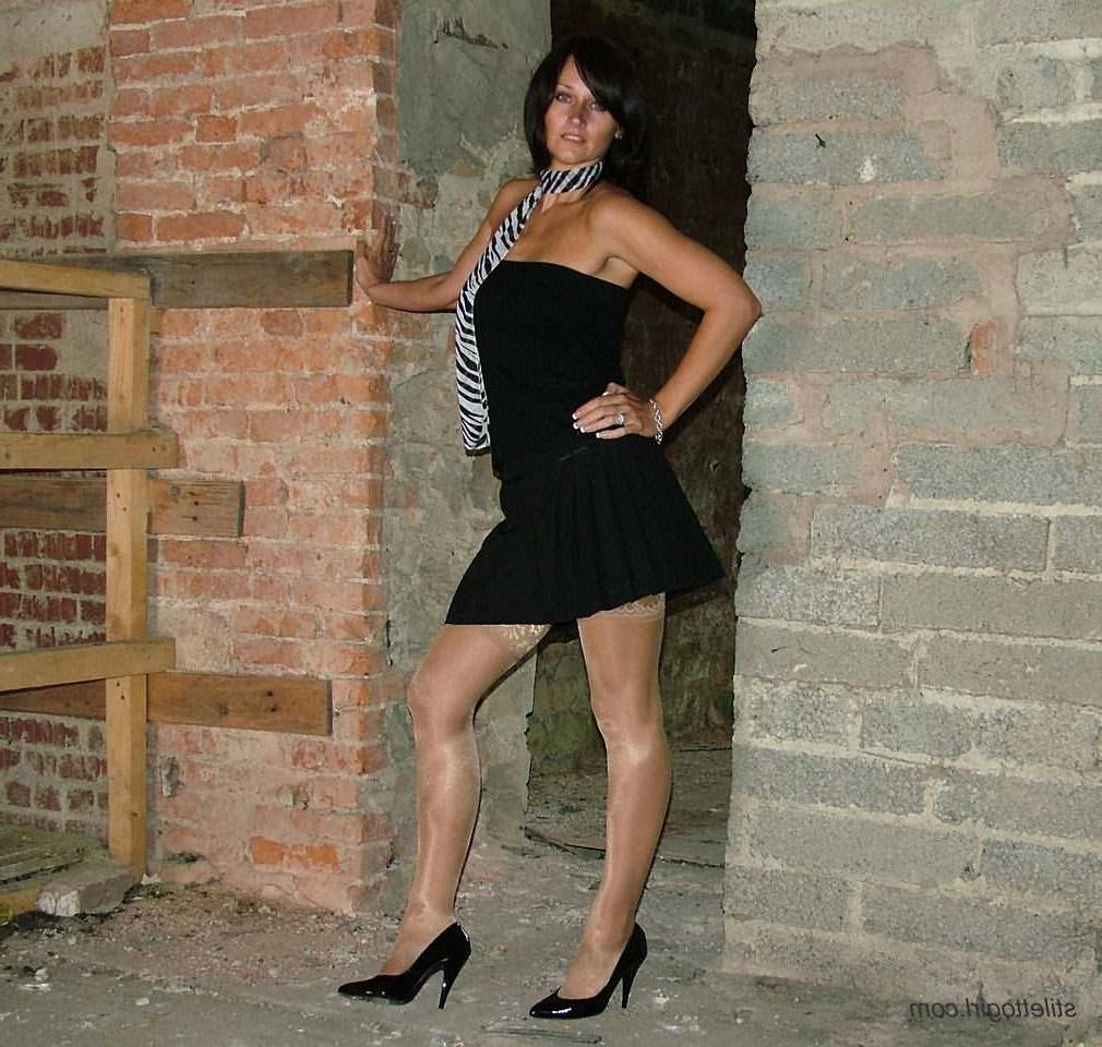 15P Shapely legs in black high heels and stockings