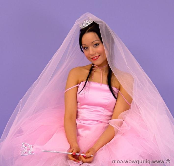 16P Beautiful bride in stockings strips her dress