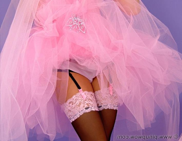 16P Beautiful bride in stockings strips her dress