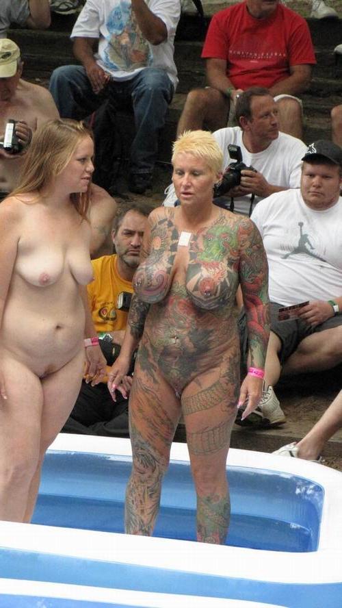 16P busty tattoed and pierced mature poser on the public